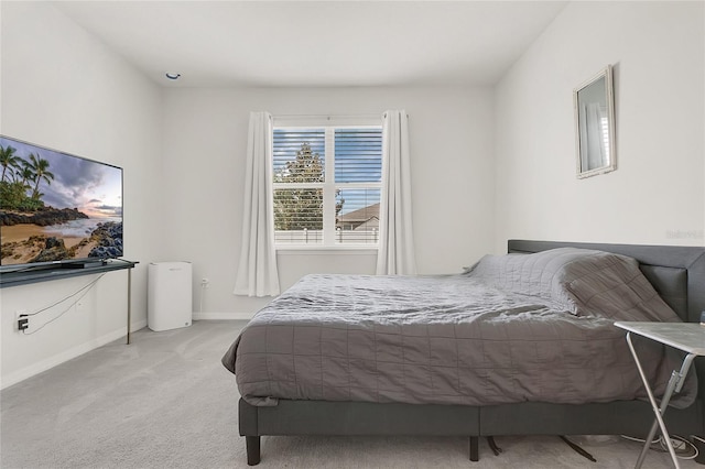 carpeted bedroom with baseboards