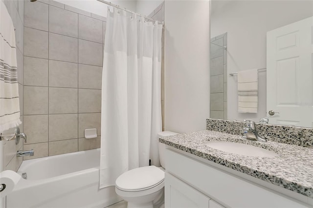 full bathroom with vanity, shower / bath combo with shower curtain, and toilet