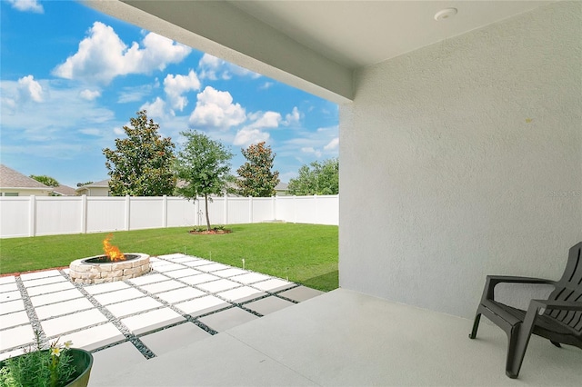 view of patio / terrace with a fenced backyard and an outdoor fire pit
