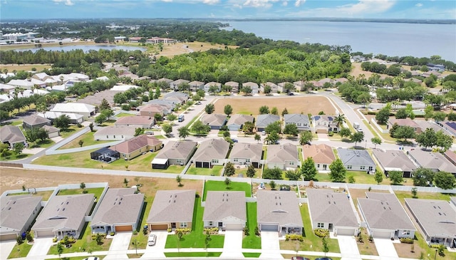 bird's eye view with a water view and a residential view