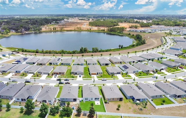birds eye view of property with a water view and a residential view
