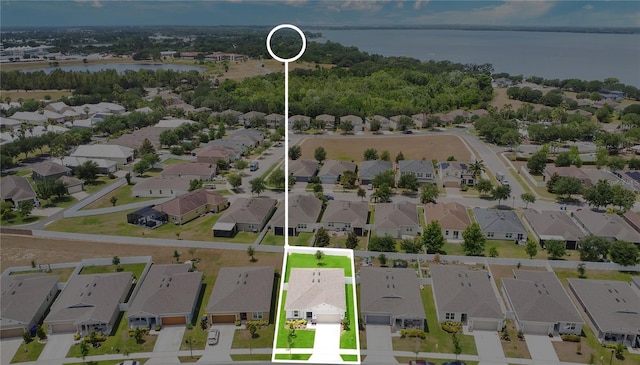 aerial view with a residential view and a water view