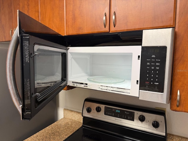 11574 Westwood Blvd Unit 1126, Orlando, FL 32821 - kitchen view of stainless steel electric range oven