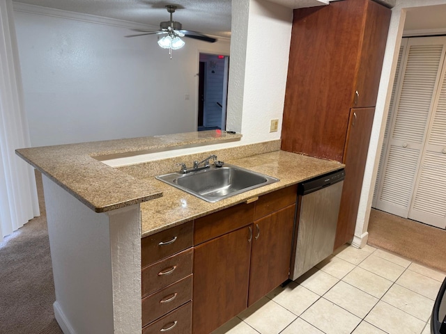 11574 Westwood Blvd Unit 1126, Orlando, FL 32821 - kitchen featuring stainless steel dishwasher, a ceiling fan, a peninsula, and light tile patterned floors