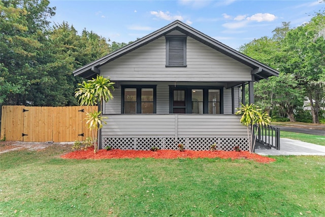 exterior space with a yard and fence