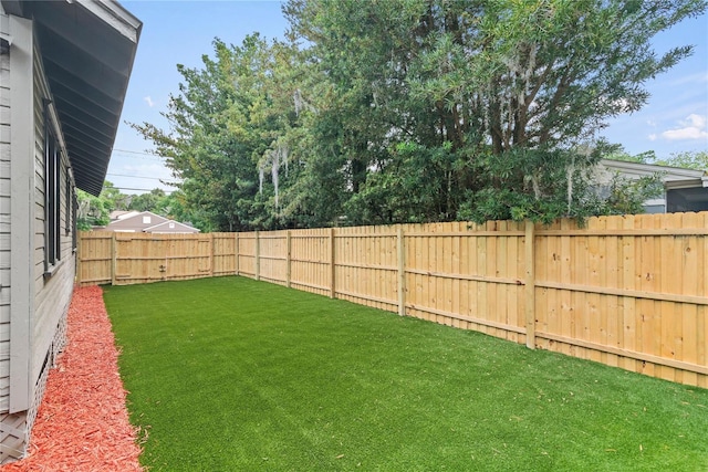 view of yard with a fenced backyard