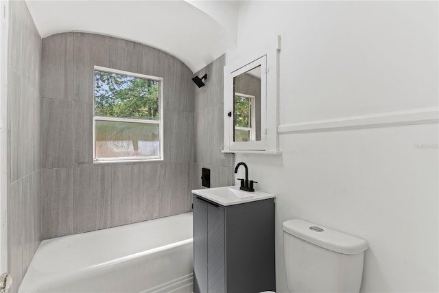 bathroom featuring vanity, shower / tub combination, and toilet