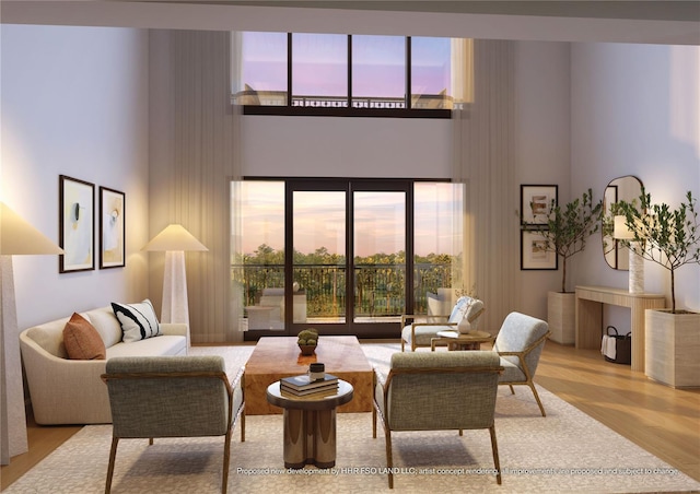 10160 Autumn Mist Ln Unit 601, Golden Oak, FL 32836 - living room featuring a towering ceiling, wood finished floors, and a healthy amount of sunlight