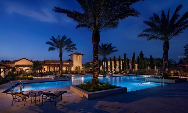 10160 Autumn Mist Ln Unit 601, Golden Oak, FL 32836 - community pool featuring a patio area and fence