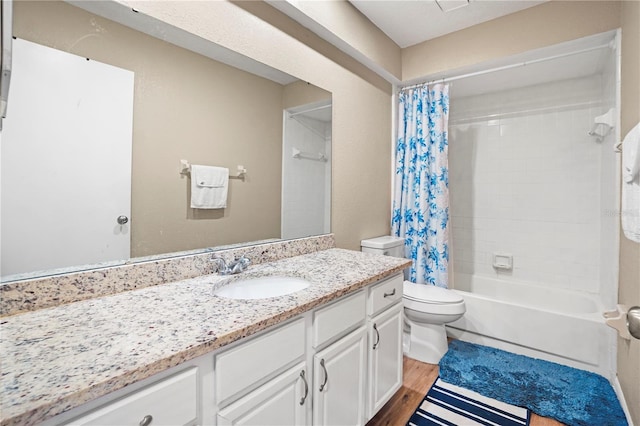 bathroom with shower / tub combo with curtain, vanity, toilet, and wood finished floors