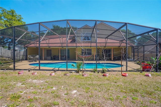view of swimming pool with a lanai, a patio area, and a fenced in pool