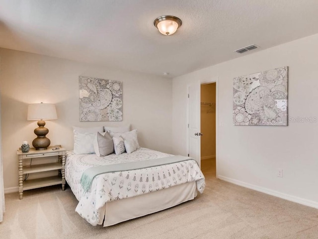 1550 Dalehurst Ln, Kissimmee, FL 34744 - bedroom featuring a spacious closet, visible vents, baseboards, and light colored carpet
