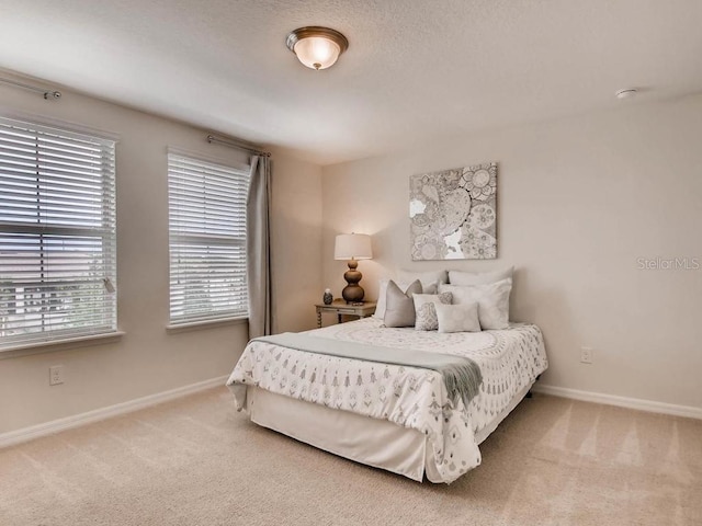 1550 Dalehurst Ln, Kissimmee, FL 34744 - bedroom with baseboards, multiple windows, and carpet