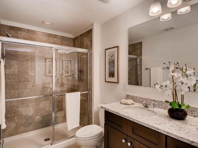 1550 Dalehurst Ln, Kissimmee, FL 34744 - bathroom featuring visible vents, toilet, a stall shower, and vanity
