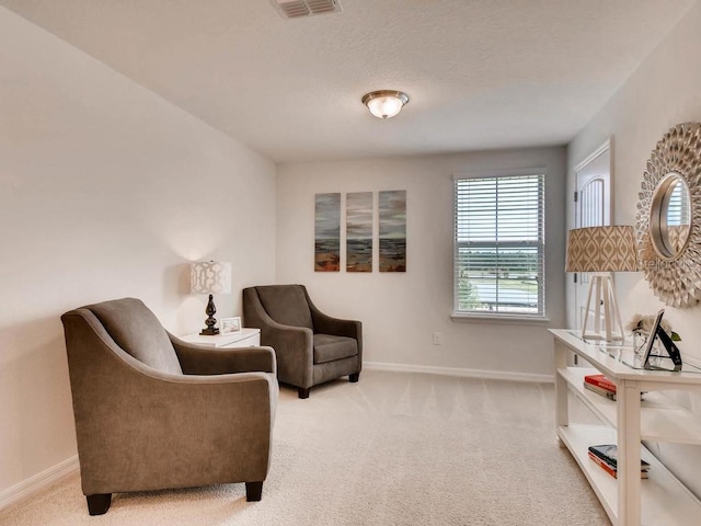 1550 Dalehurst Ln, Kissimmee, FL 34744 - living area featuring light carpet, baseboards, and visible vents