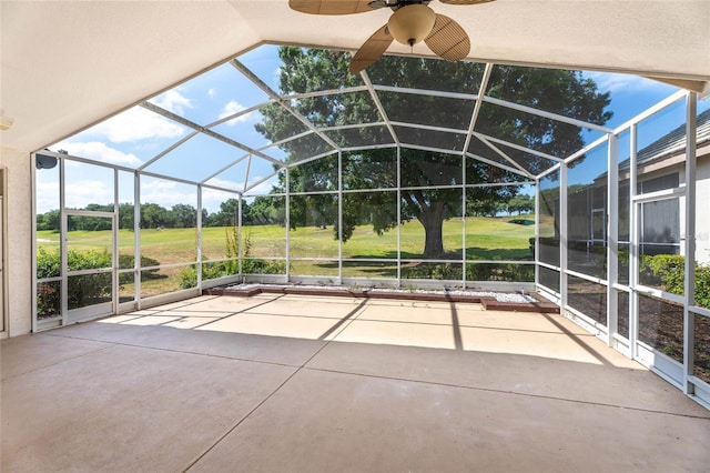 view of patio / terrace featuring ceiling fan and a lanai