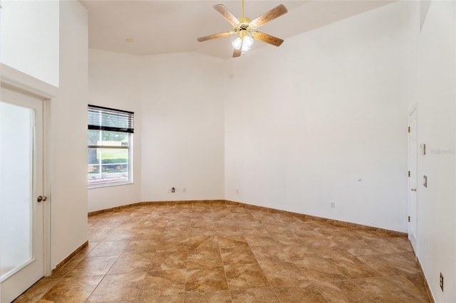 unfurnished room featuring ceiling fan and high vaulted ceiling