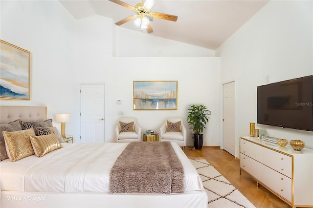 bedroom with high vaulted ceiling and a ceiling fan