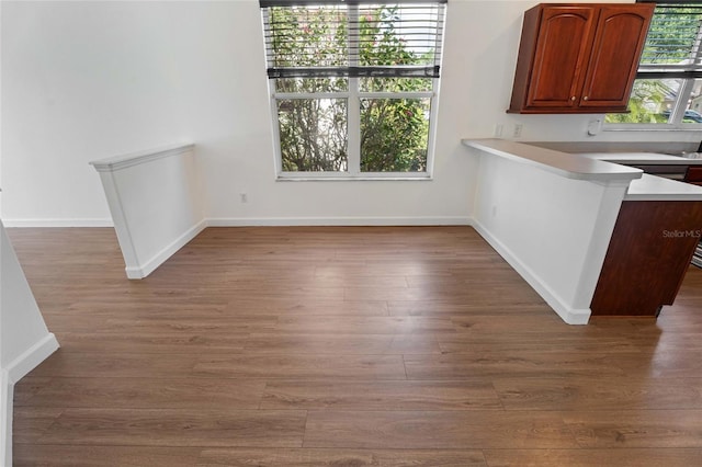 7264 Hawksnest Blvd, Orlando, FL 32835 - unfurnished dining area with baseboards and wood finished floors