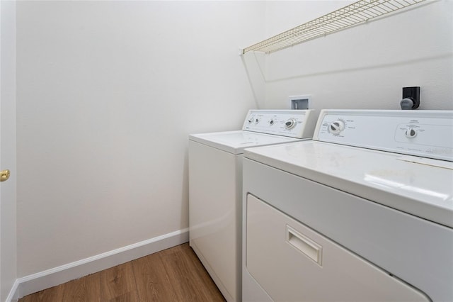 7264 Hawksnest Blvd, Orlando, FL 32835 - washroom featuring washer and clothes dryer and light wood-style flooring