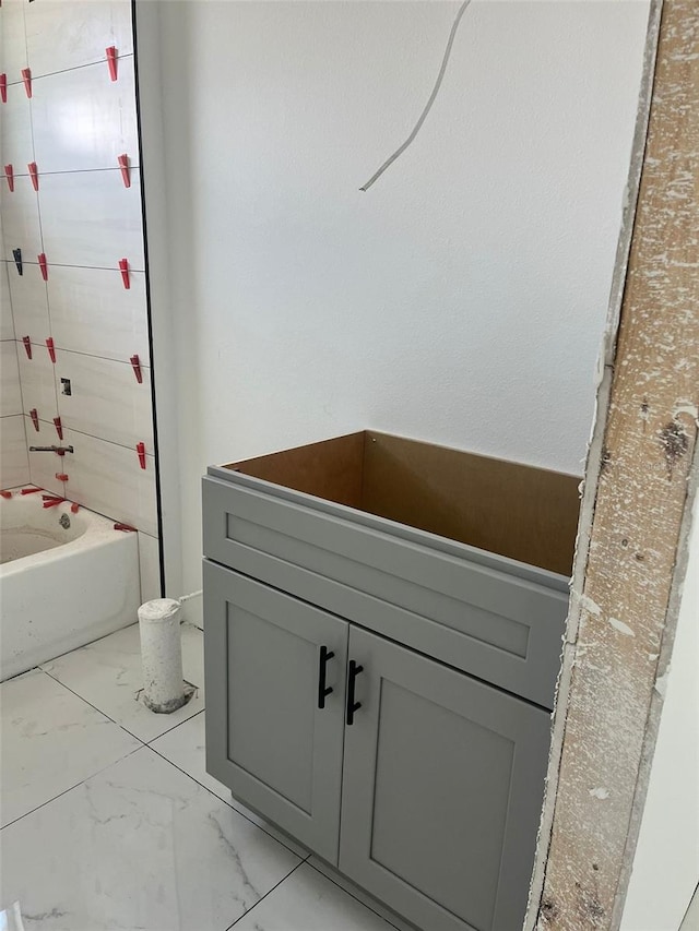 24462 Cabana Rd, Punta Gorda, FL 33955 - full bath with marble look tile flooring and bathing tub / shower combination