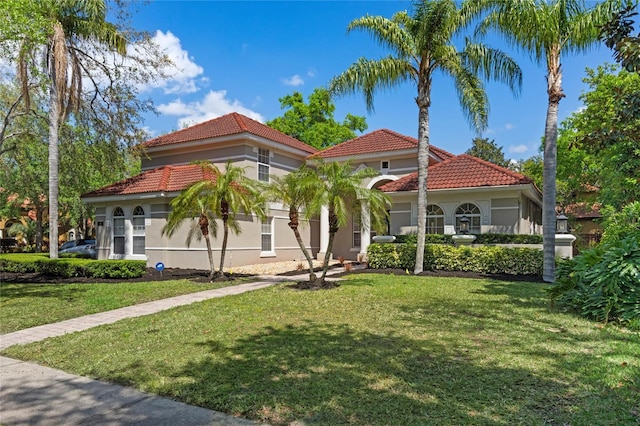 1803 Glenbay Ct, Windermere, FL 34786 - mediterranean / spanish house featuring a tiled roof, stucco siding, and a front lawn