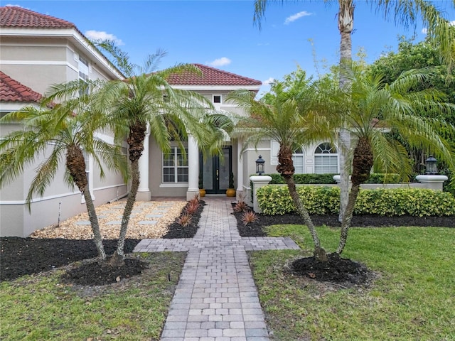 1803 Glenbay Ct, Windermere, FL 34786 - mediterranean / spanish house with stucco siding, french doors, and a tile roof