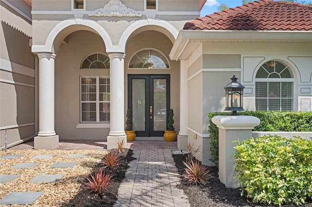 1803 Glenbay Ct, Windermere, FL 34786 - property entrance with french doors, stucco siding, and a tile roof