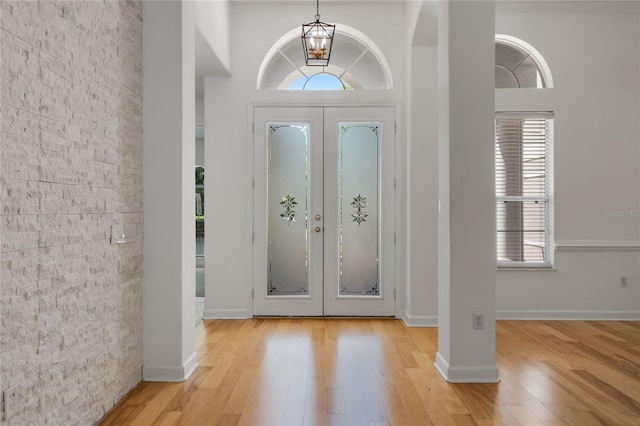 1803 Glenbay Ct, Windermere, FL 34786 - foyer entrance featuring french doors, light wood-style flooring, and a wealth of natural light
