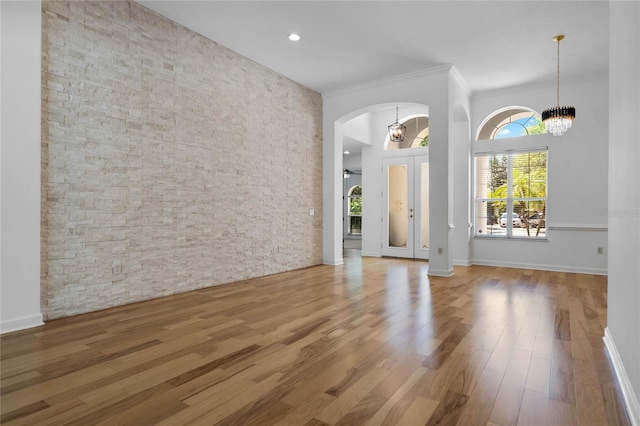 1803 Glenbay Ct, Windermere, FL 34786 - interior space featuring crown molding, a high ceiling, arched walkways, a chandelier, and wood finished floors