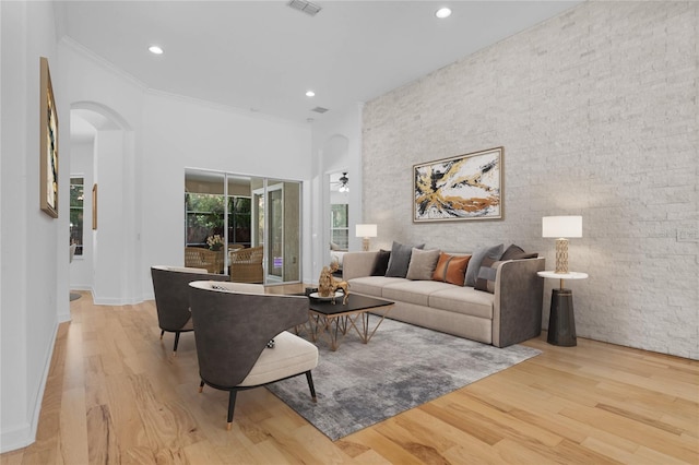 1803 Glenbay Ct, Windermere, FL 34786 - living area featuring recessed lighting, arched walkways, an accent wall, and wood finished floors