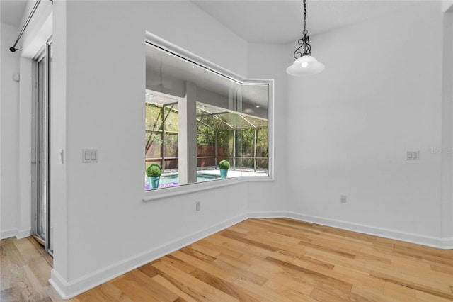 1803 Glenbay Ct, Windermere, FL 34786 - unfurnished dining area featuring baseboards and wood finished floors