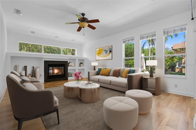 1803 Glenbay Ct, Windermere, FL 34786 - living area featuring ceiling fan, visible vents, a healthy amount of sunlight, and light wood-style flooring