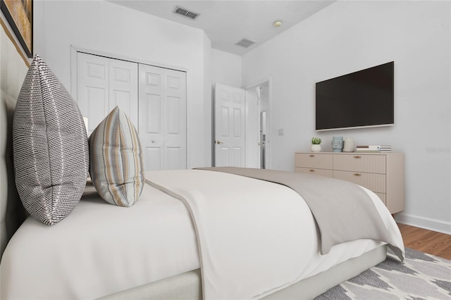 1803 Glenbay Ct, Windermere, FL 34786 - bedroom featuring visible vents, baseboards, wood finished floors, and a closet