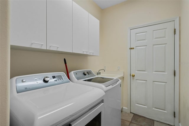 1803 Glenbay Ct, Windermere, FL 34786 - laundry room featuring cabinet space, separate washer and dryer, a sink, and light tile patterned floors