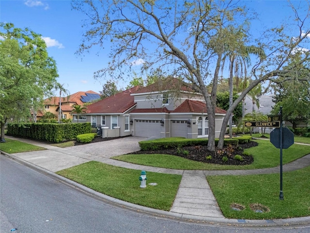 1803 Glenbay Ct, Windermere, FL 34786 - mediterranean / spanish house featuring a front lawn, a tile roof, a garage, stucco siding, and driveway