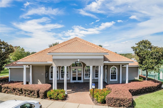 1803 Glenbay Ct, Windermere, FL 34786 - view of front of home with french doors, stucco siding, and a tiled roof