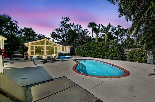 913 Tennessee Ln, Sarasota, FL 34234 - pool at dusk featuring a patio area