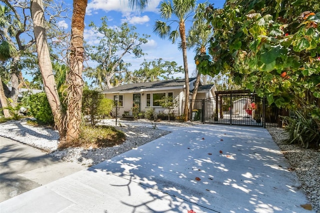 913 Tennessee Ln, Sarasota, FL 34234 - ranch-style house with a gate and driveway