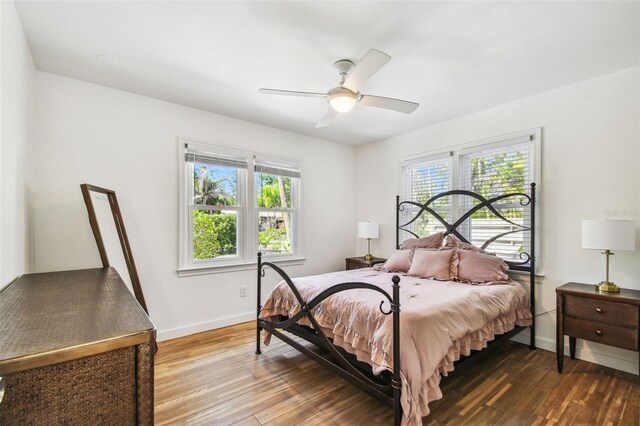 913 Tennessee Ln, Sarasota, FL 34234 - bedroom with wood finished floors, baseboards, and a ceiling fan
