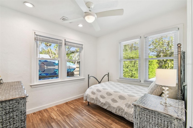 913 Tennessee Ln, Sarasota, FL 34234 - bedroom with wood finished floors, baseboards, a ceiling fan, and recessed lighting