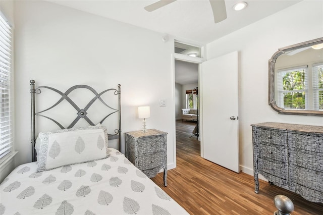 913 Tennessee Ln, Sarasota, FL 34234 - bedroom featuring wood finished floors, multiple windows, ceiling fan, baseboards, and recessed lighting