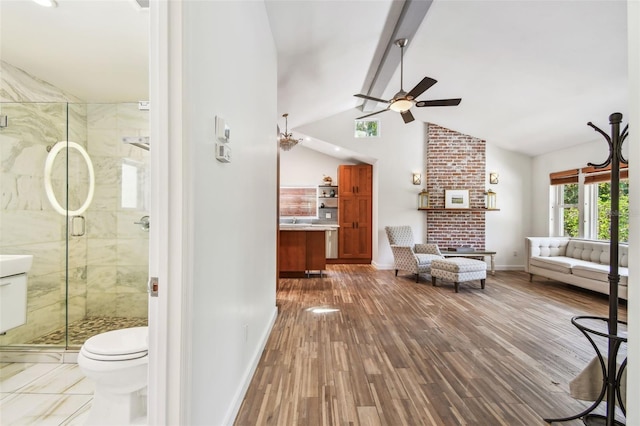 913 Tennessee Ln, Sarasota, FL 34234 - living room featuring ceiling fan, baseboards, wood finished floors, and high vaulted ceiling