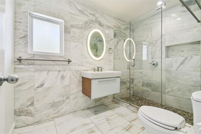 913 Tennessee Ln, Sarasota, FL 34234 - bathroom featuring toilet, a shower stall, vanity, tile walls, and marble look tile flooring