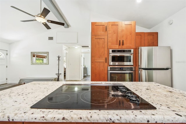 913 Tennessee Ln, Sarasota, FL 34234 - kitchen featuring stainless steel appliances, brown cabinets, light stone counters, high vaulted ceiling, and beam ceiling