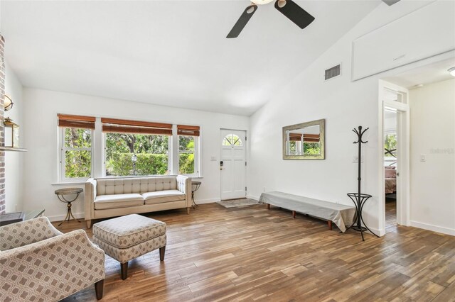 913 Tennessee Ln, Sarasota, FL 34234 - living room featuring ceiling fan, wood finished floors, baseboards, and high vaulted ceiling
