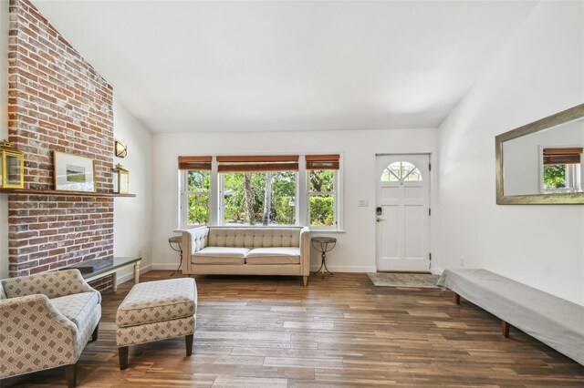 913 Tennessee Ln, Sarasota, FL 34234 - living area with wood finished floors, baseboards, and vaulted ceiling