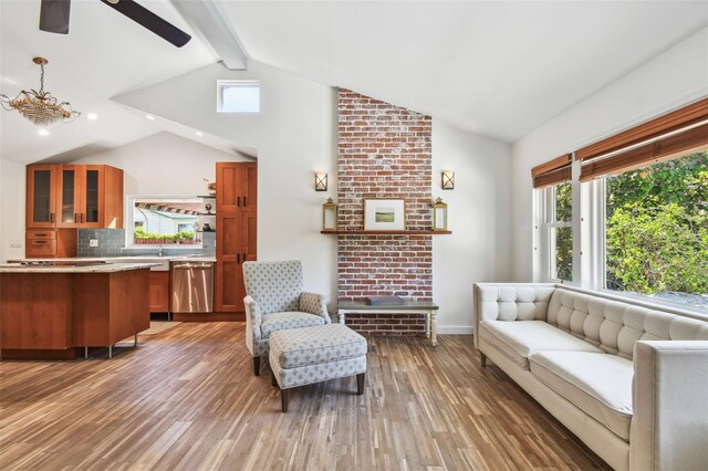 913 Tennessee Ln, Sarasota, FL 34234 - living room with wood finished floors, healthy amount of natural light, a ceiling fan, a fireplace, and recessed lighting
