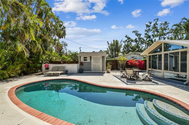 913 Tennessee Ln, Sarasota, FL 34234 - view of swimming pool featuring a patio area, a fenced backyard, and a sunroom