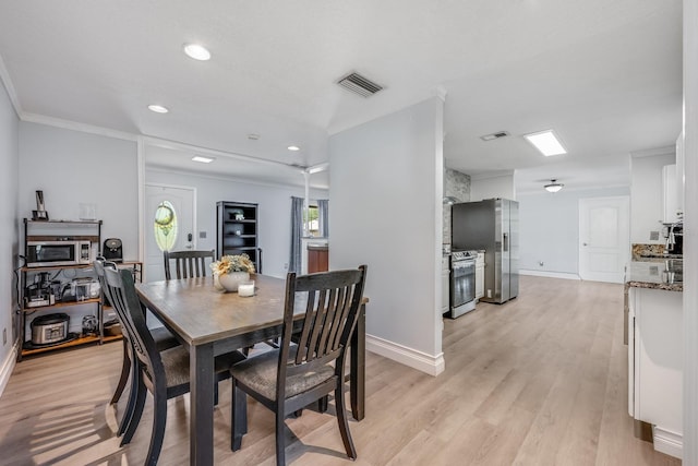 dining space with baseboards, recessed lighting, crown molding, visible vents, and light wood finished floors